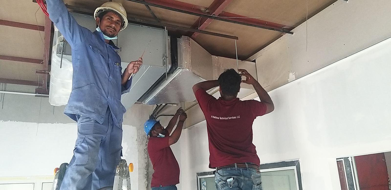 Duct installation team at work